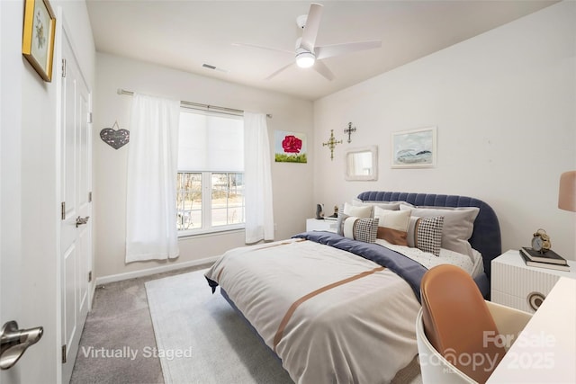 carpeted bedroom with ceiling fan