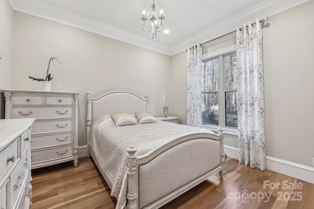 bedroom with a chandelier, dark hardwood / wood-style flooring, and ornamental molding