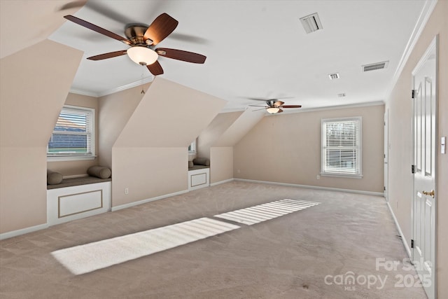 bonus room with ceiling fan, light carpet, and plenty of natural light