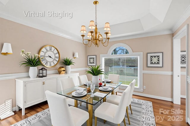 430 43rd Ave NW, Hickory, NC 28601 - dining space featuring a chandelier, wood finished floors, a raised ceiling, baseboards, and ornamental molding
