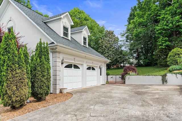 430 43rd Ave NW, Hickory, NC 28601 - view of side of property with concrete driveway, a garage, roof with shingles, stucco siding, and fence