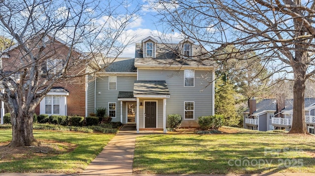 view of front of house with a front lawn