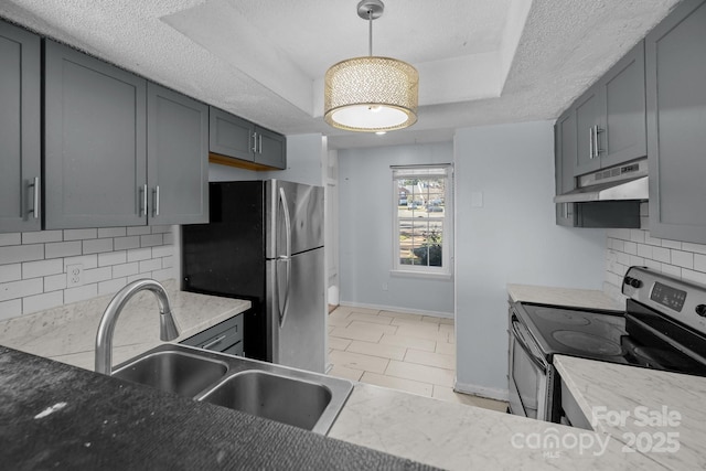 kitchen featuring backsplash, gray cabinets, sink, and appliances with stainless steel finishes