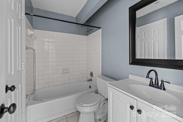 full bathroom featuring toilet, vanity, tile patterned floors, and tiled shower / bath