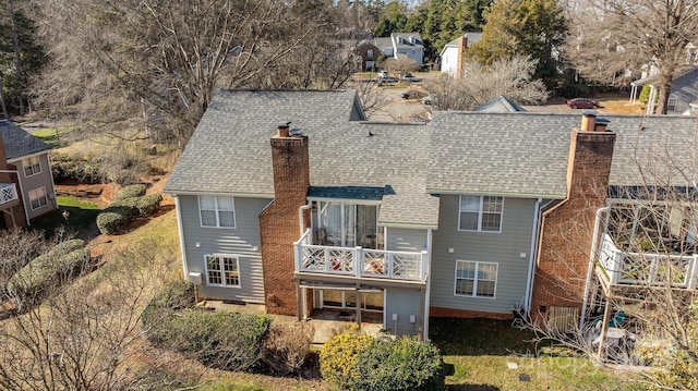 rear view of house with a balcony