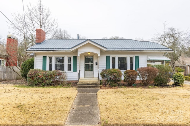 bungalow-style house with a front yard