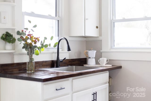 kitchen with sink and white cabinets