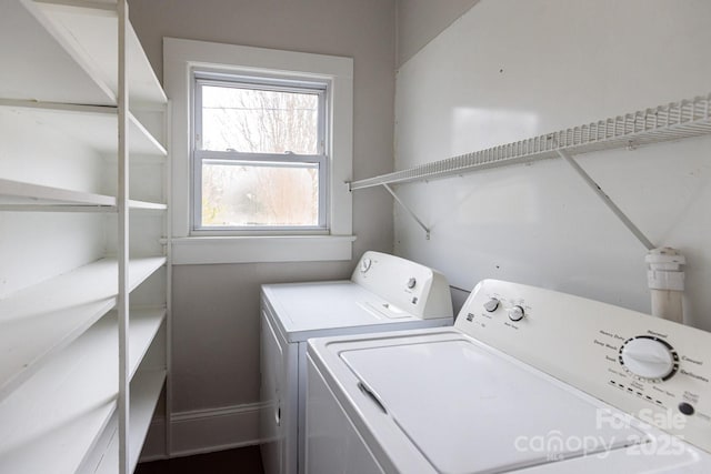 laundry room featuring washer and clothes dryer