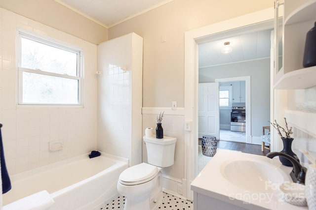 bathroom featuring crown molding, plenty of natural light, vanity, and toilet