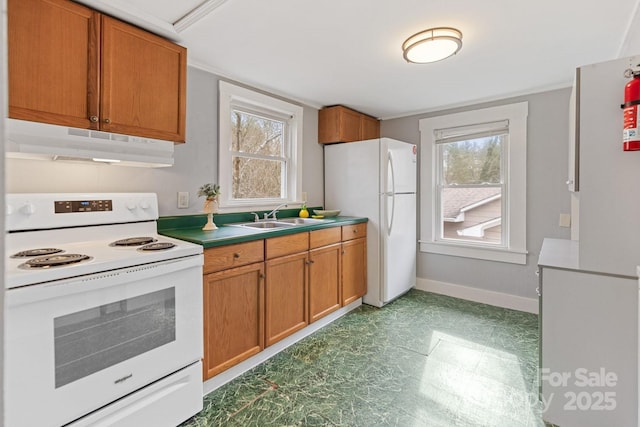 kitchen featuring white appliances and sink