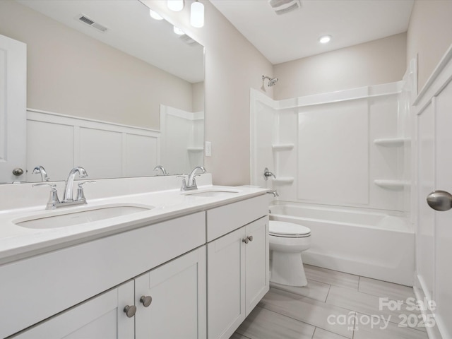 full bathroom featuring tile patterned flooring, vanity, shower / bathtub combination, and toilet