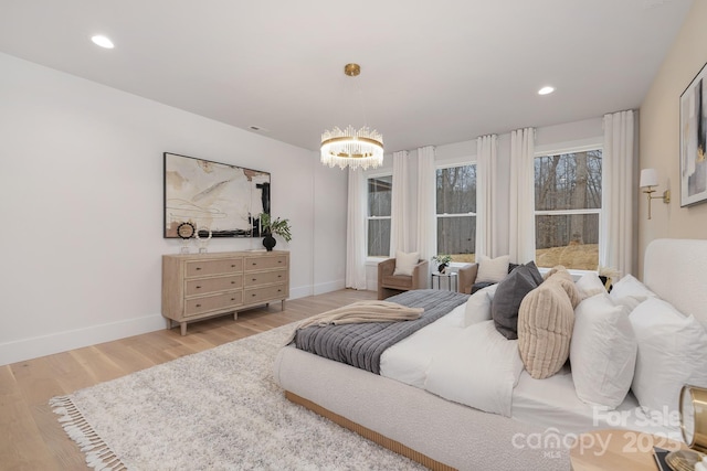 bedroom featuring recessed lighting, baseboards, and wood finished floors