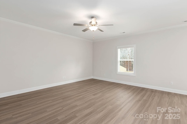 unfurnished room with crown molding, ceiling fan, and hardwood / wood-style flooring