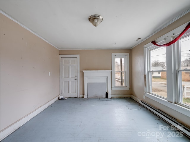 unfurnished living room featuring baseboard heating and crown molding