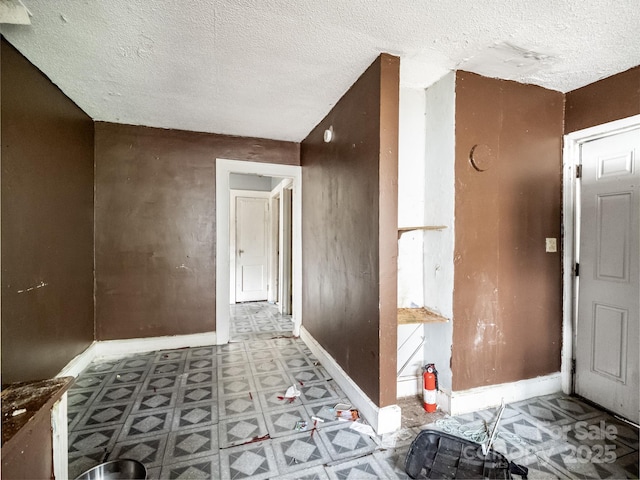 corridor with a textured ceiling