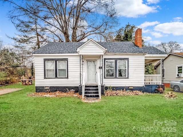 view of front of home with a front yard