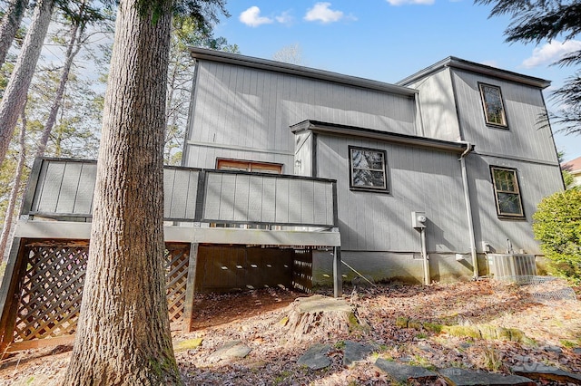 back of property featuring central AC