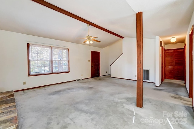 interior space with ceiling fan and lofted ceiling with beams