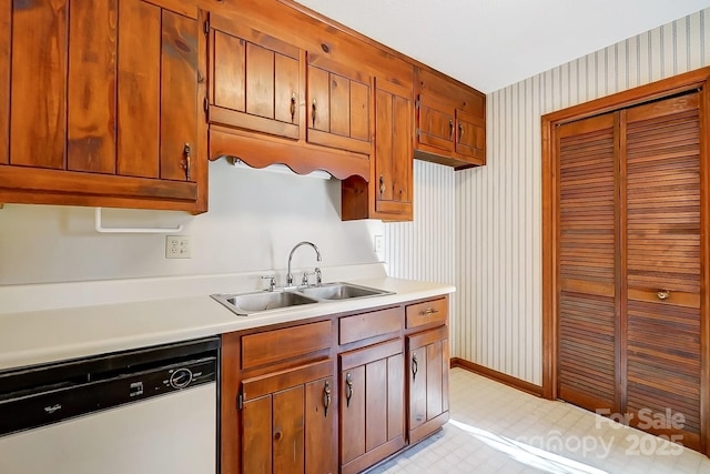 kitchen featuring sink and white dishwasher