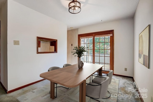 view of carpeted dining space