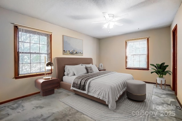 bedroom featuring a textured ceiling, ceiling fan, and carpet