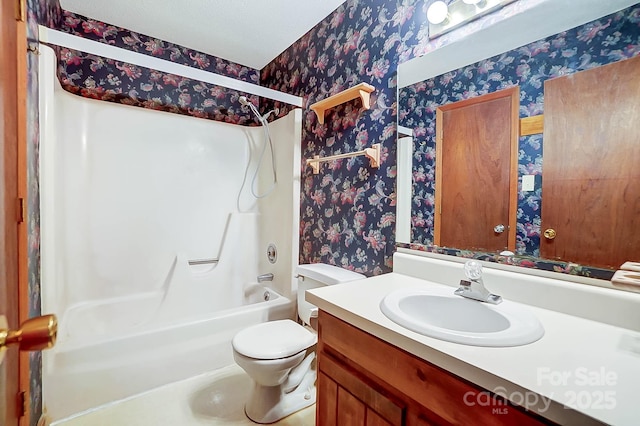 full bathroom featuring bathtub / shower combination, toilet, and vanity