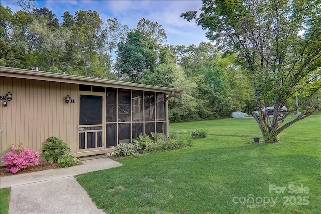 view of yard featuring a sunroom