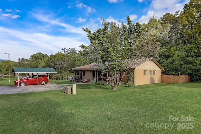 view of yard with a carport