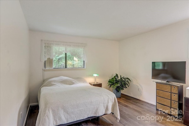 bedroom featuring hardwood / wood-style flooring