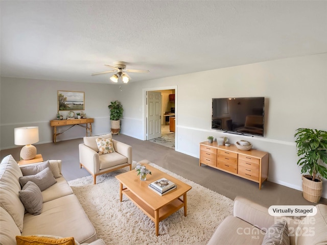 living room with ceiling fan and a textured ceiling