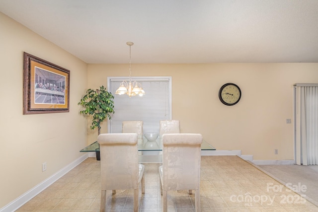 dining space featuring a notable chandelier