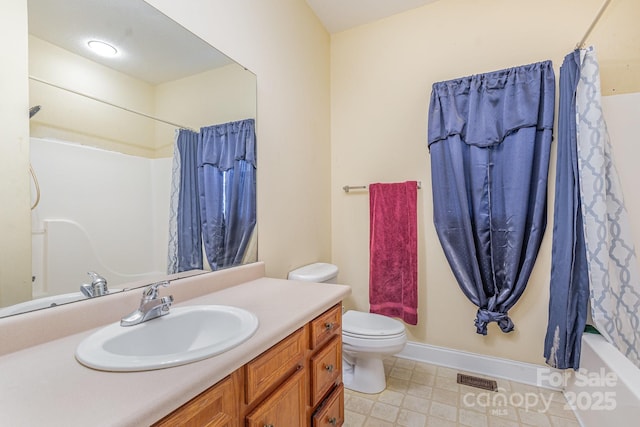 full bathroom with vanity, shower / bath combination with curtain, and toilet