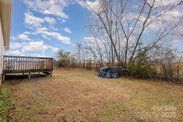 view of yard with a deck