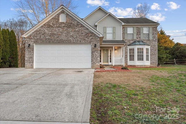 view of front property with a garage and a front yard