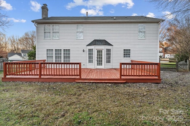 rear view of property with a deck