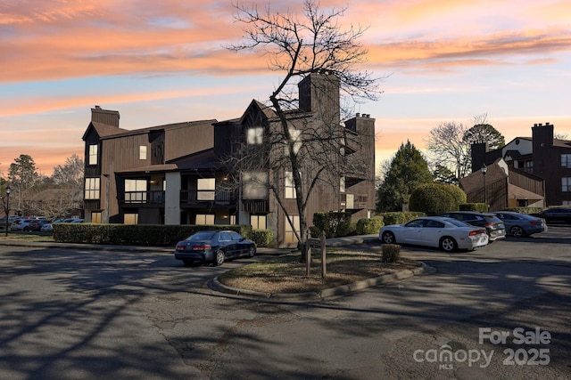 view of outdoor building at dusk