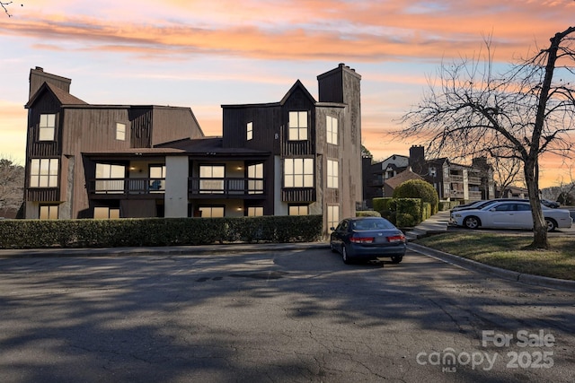 view of outdoor building at dusk