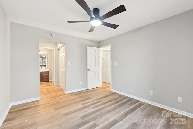 unfurnished bedroom with ceiling fan and light hardwood / wood-style floors