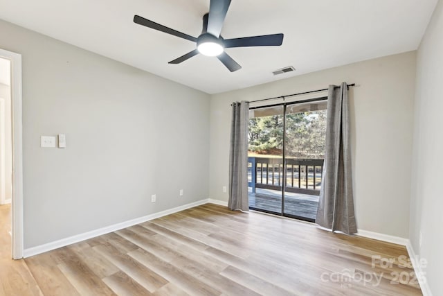 spare room with ceiling fan and light hardwood / wood-style floors