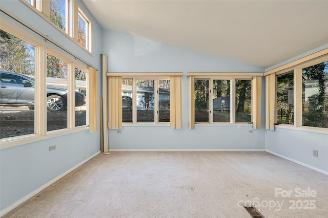 unfurnished sunroom featuring vaulted ceiling