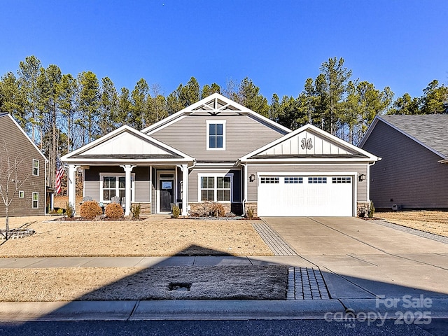 craftsman-style home with a garage and covered porch