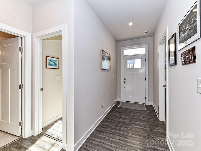 doorway with dark hardwood / wood-style floors