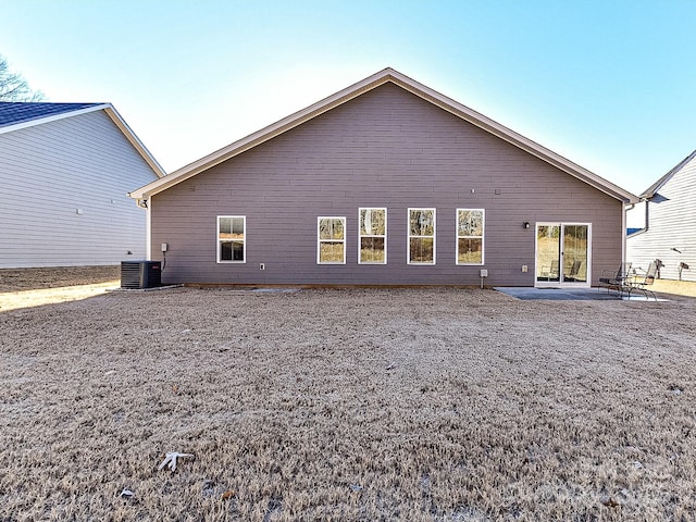 back of house with central air condition unit and a patio area