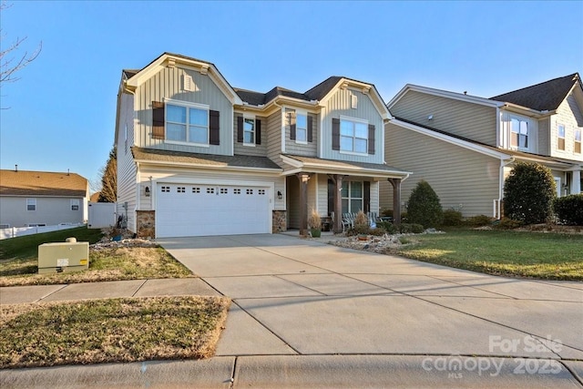 view of front of property with a garage and a front yard