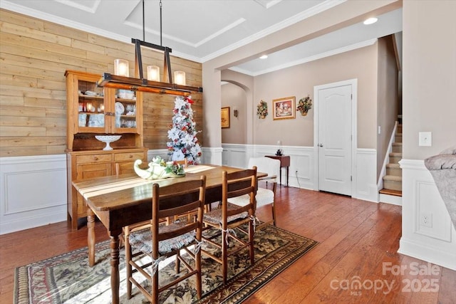 dining space featuring crown molding and hardwood / wood-style floors