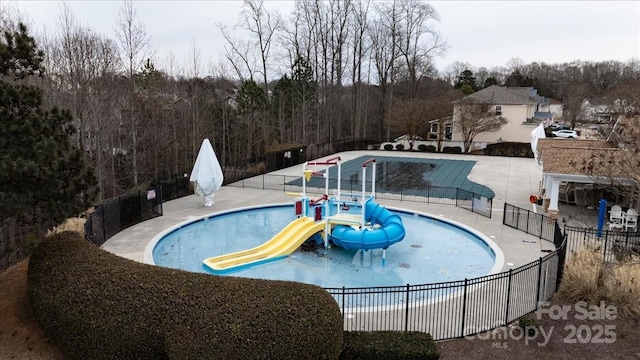 view of pool with a playground