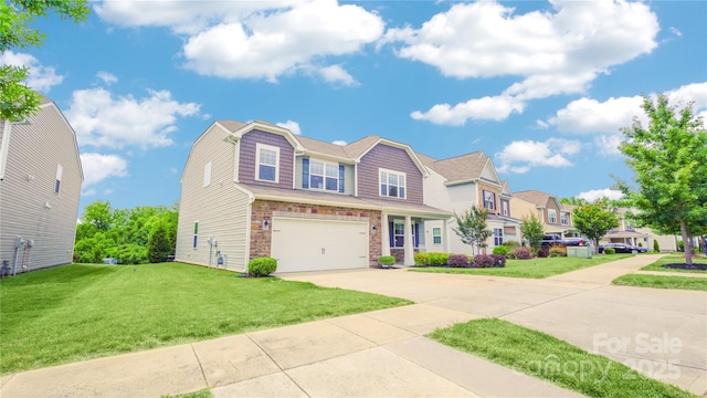 townhome / multi-family property featuring a garage and a front lawn