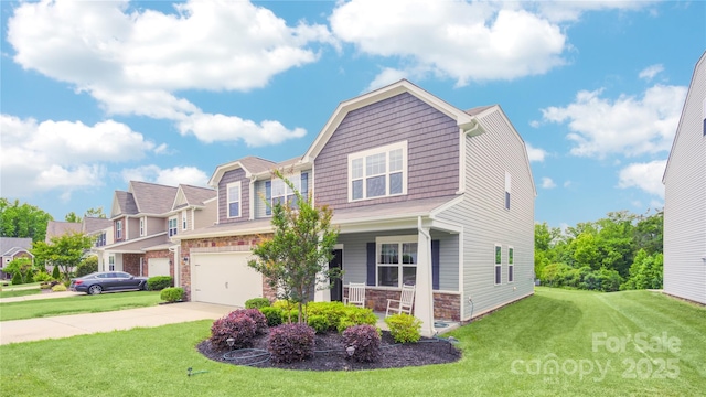 view of front of property with a front lawn, covered porch, and a garage