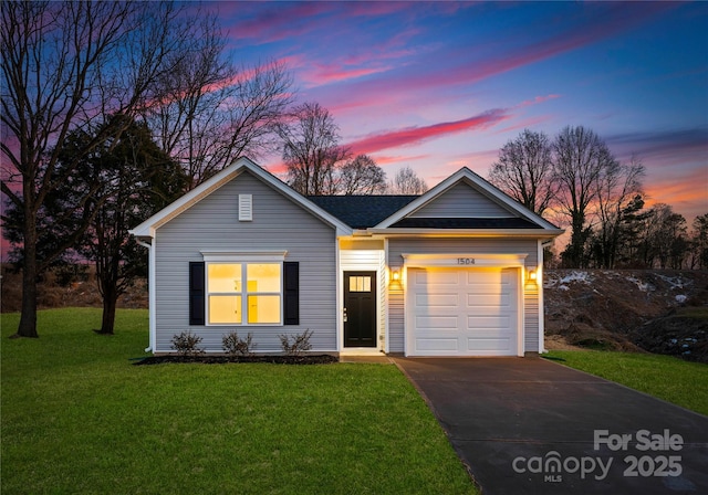 ranch-style house with a lawn and a garage