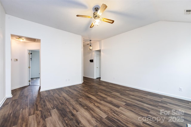 unfurnished room featuring vaulted ceiling, ceiling fan, and dark hardwood / wood-style floors